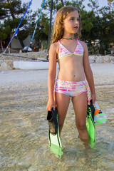 Summer sport, beach - young girl diver in the sea