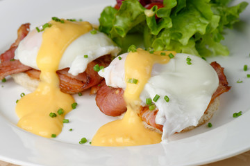 Eggs Benedict- toasted English muffins, ham, poached eggs