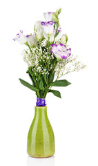 Bouquet of eustoma flowers in vase, isolated on white