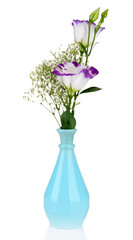 Bouquet of eustoma flowers in vase, isolated on white