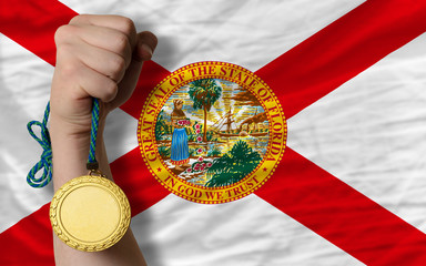 Gold medal for sport and  flag of american state of florida