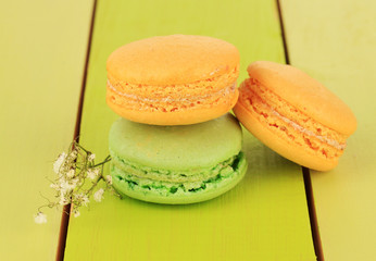 Macaroons on wooden table close-up