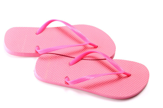 picture of red summer flip flops over white