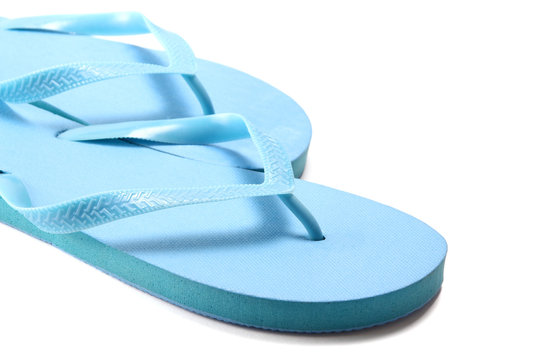 picture of blue summer flip flops over white