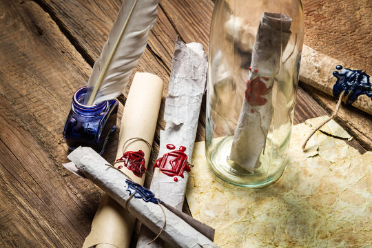 Preparing to send ancient letter in a bottle with blue ink