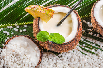 Closeup of pinacolada drink served in a coconut