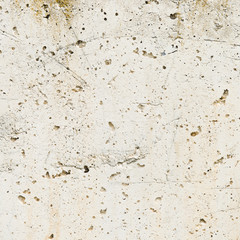 White smooth wall with some holes.