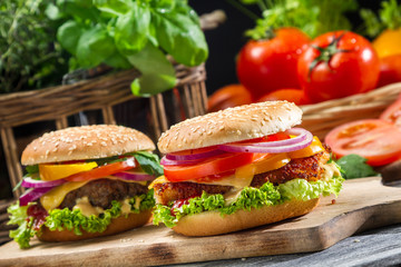 Closeup of two homemade hamburgers made from fresh vegetables - obrazy, fototapety, plakaty