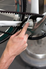 Closeup of the hands of bicycle mechanic at work
