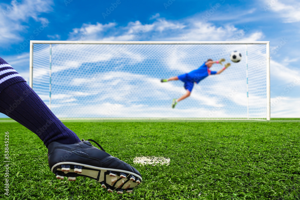 Wall mural foot kicking soccer ball