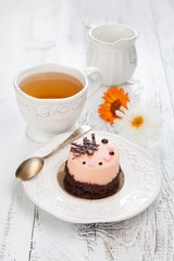 Sweet cake on a white wooden table