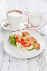 Fresh croissants with cheese on a table