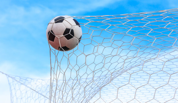 soccer ball in goal net