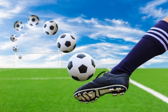 foot kicking soccer ball