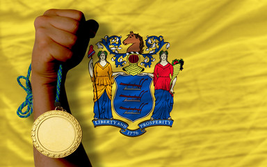 Gold medal for sport and  flag of american state of new jersey