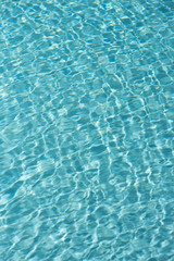Fototapeta na wymiar Teal Blue Water in a Swimming Pool