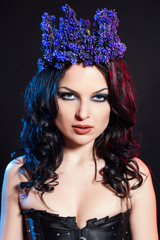 Portrait of beautiful woman wearing crown of flowers on head