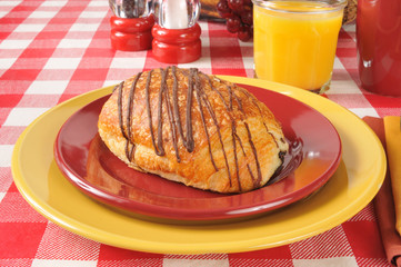 Chocolate croissant with orange juice