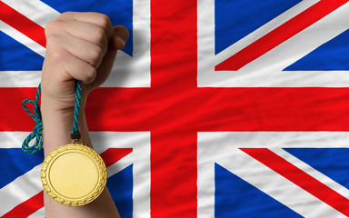Gold medal for sport and  national flag of united kingdom