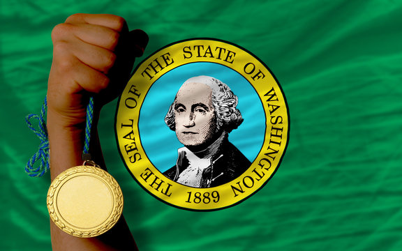 Gold medal for sport and flag of american state of washington