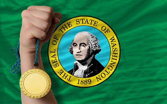 Gold medal for sport and flag of american state of washington