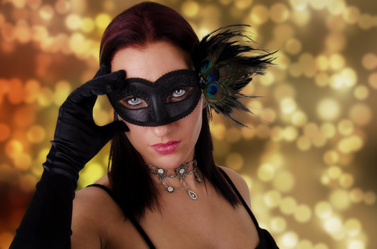 Beautiful woman in carnival mask.
