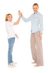 mum and son standing and smiling giving five isolated on white b