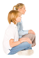 mum and son sat on the floor smiling isolated on white backgroun