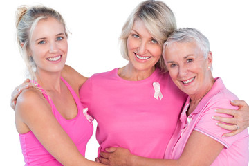 Women wearing pink tops and ribbons for breast cancer - obrazy, fototapety, plakaty
