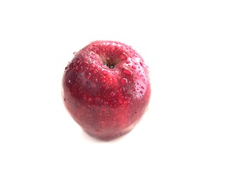 Wet red apple with water drop isolated on white background