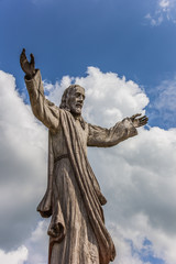 Fototapeta premium Wooden Jesus statue at the hill of crosses