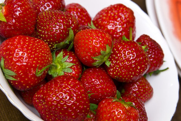 Fresh ripe strawberry closeup .