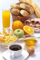 Breakfast with coffee, bread, honey,  juice, egg