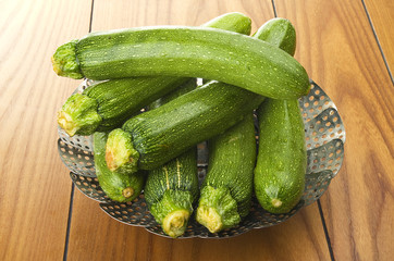 Fresh zucchini close up on the white