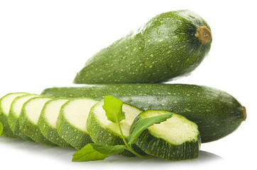 Fresh zucchini close up on the white