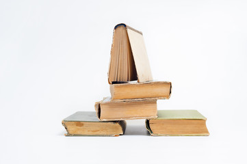 Stack of old books on a white background