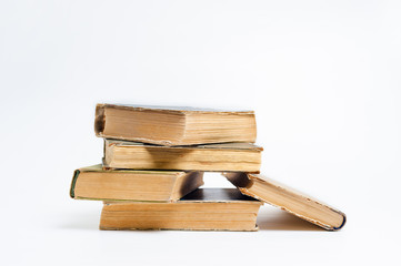 Stack of old books on a white background