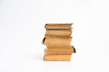 Stack of old books on a white background