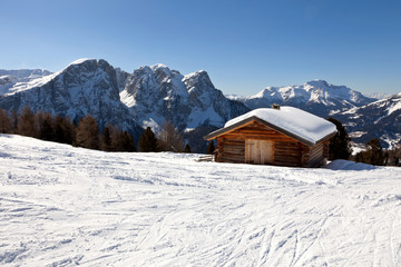 Fototapeta na wymiar Alpine cottage in Dolomites mountains, Italy