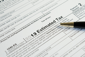 U. S. Tax form and pen