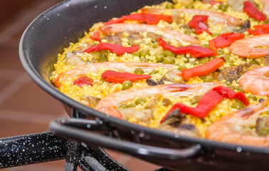 Detail of traditional spanish paella cooked in a pan