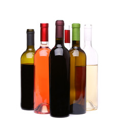 Many bottles of wine on a white background
