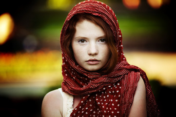 Young tranquil woman outdoors portrait