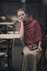 beautiful girl waiting at table in cafe