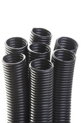 Black corrugated pipe isolated on white background