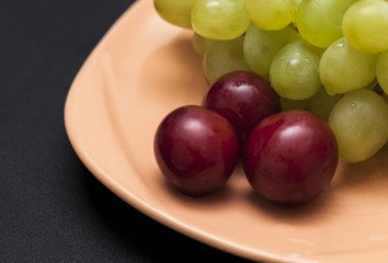 three plums and grape