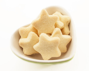 Star cookies on a heart bowl.