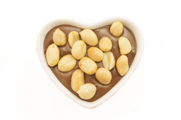 Peanuts on chocolate. Romantic concept