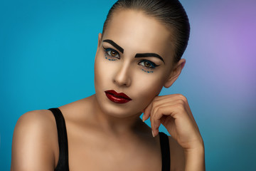 Fototapeta premium beautiful portrait of a young girl with bright makeup