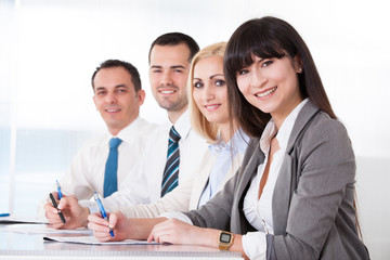 Business People Writing Meeting Notes